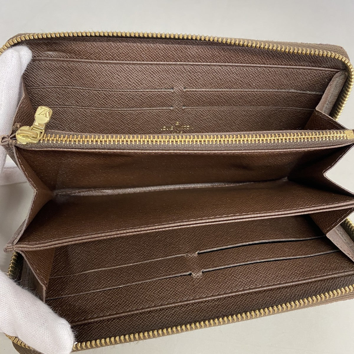 【6fd6063】ルイヴィトン 長財布 モノグラム・ミニラン ジッピーウォレット M95235 エベヌ【中古】メンズ レディース ユニセックス