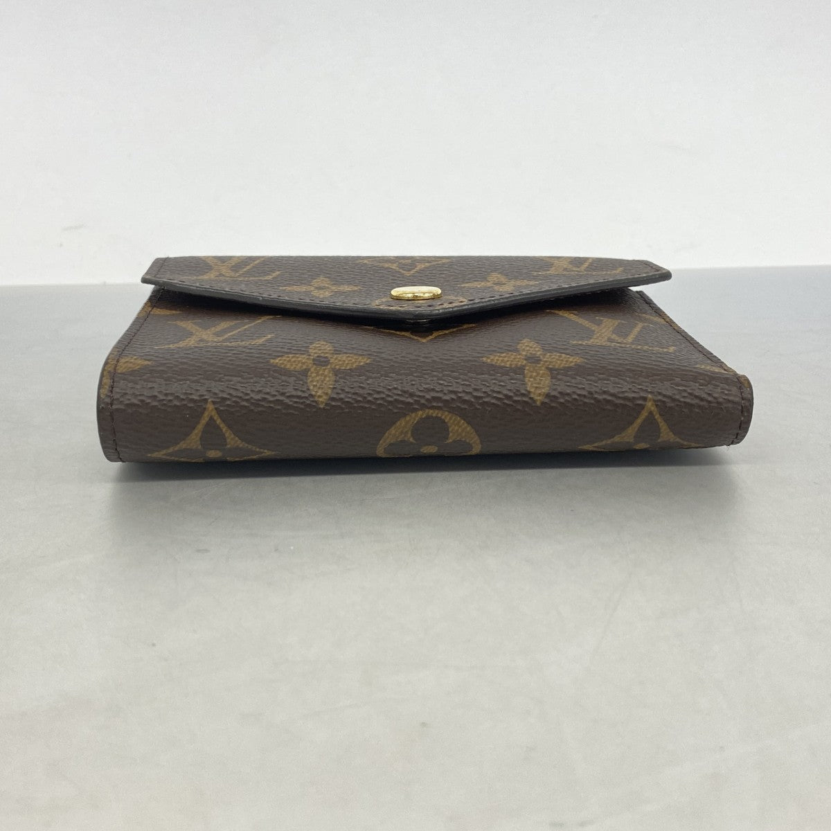 【6gd4108】ルイヴィトン 三つ折り財布 モノグラム ポルトフォイユヴィクトリーヌ M62472 ブラウン【中古】レディース